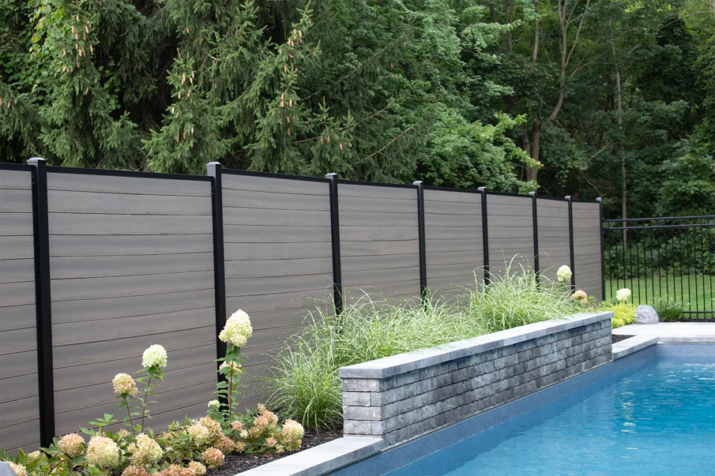 Grey Composite Fence in a backyard 